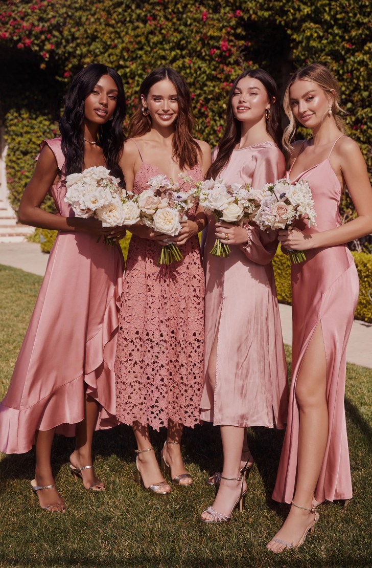 bridal party wearing pink silky and lace floral bridesmaid dresses from ASTR the Label