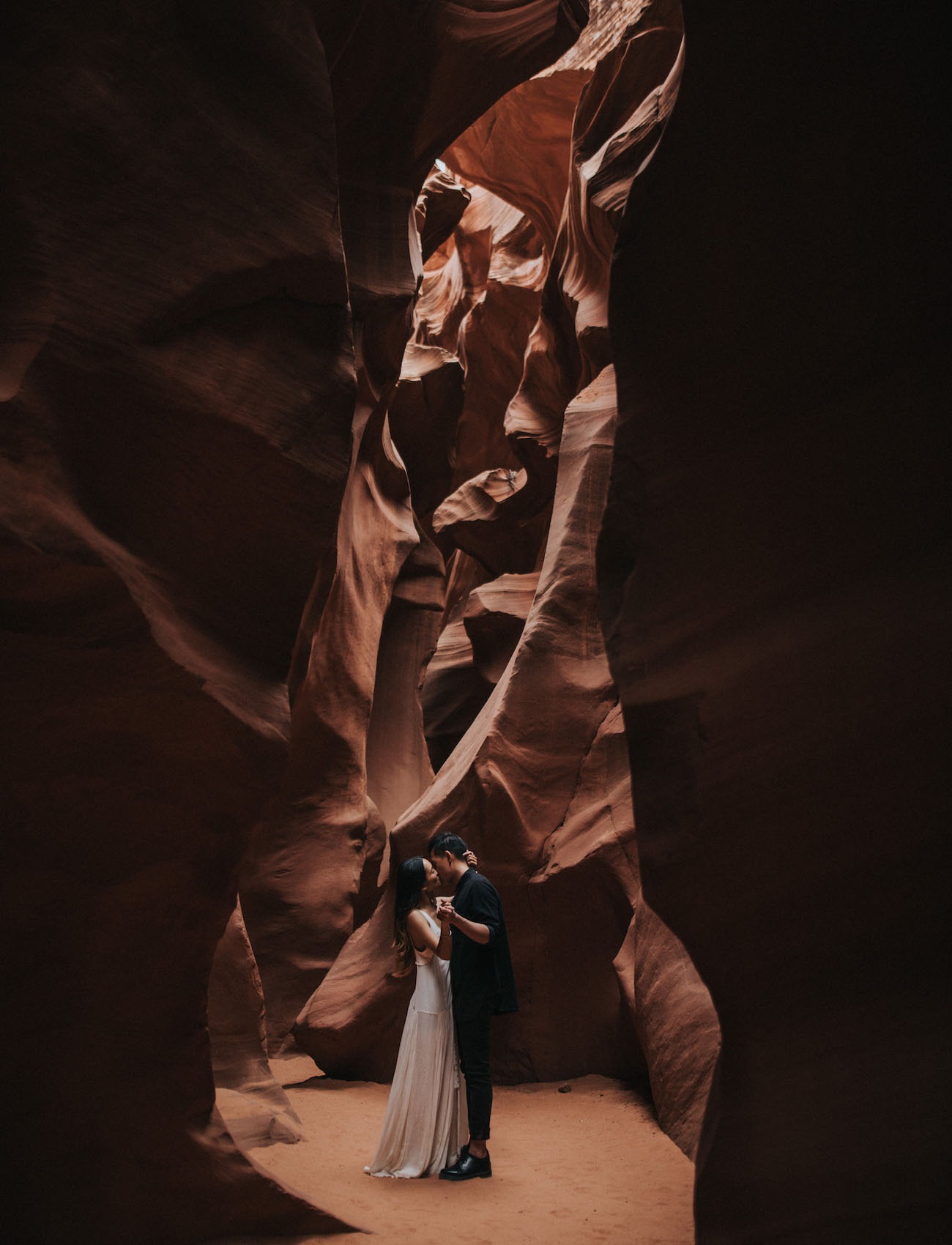 couple exploring a slot canyon in Page Arizona