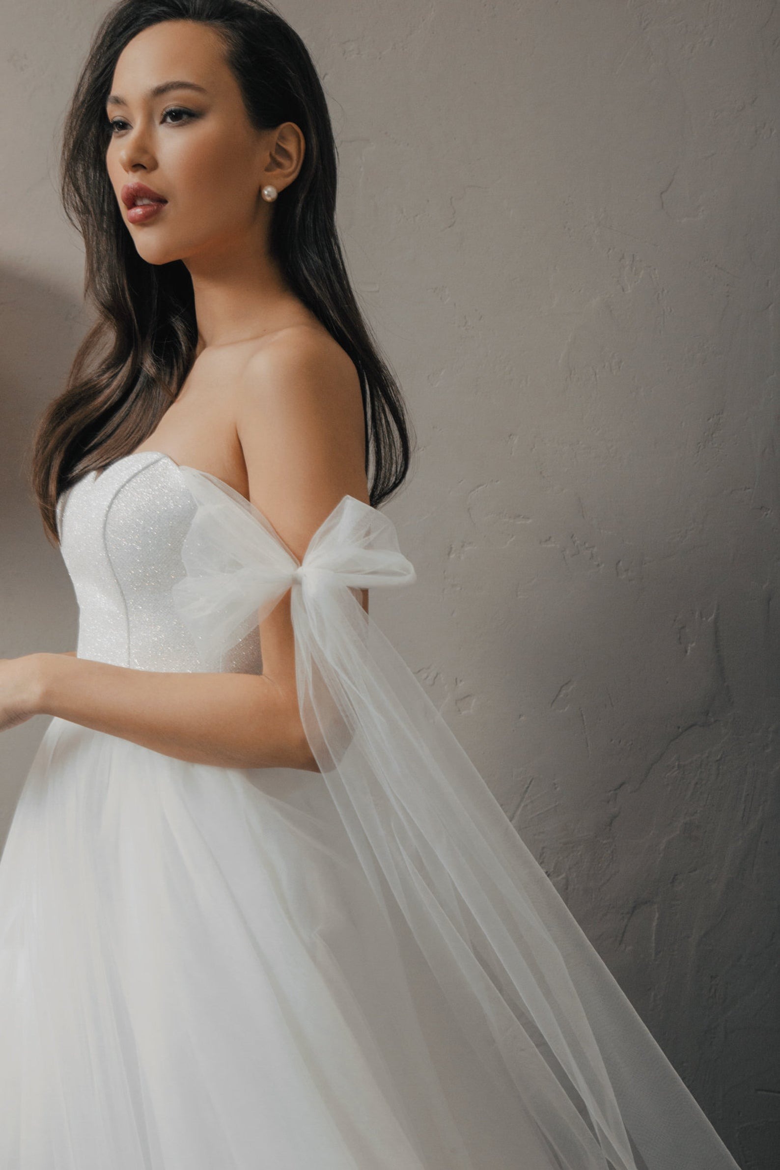whimsical off shoulder online wedding dresses with tulle bowtie detailing from Piondress