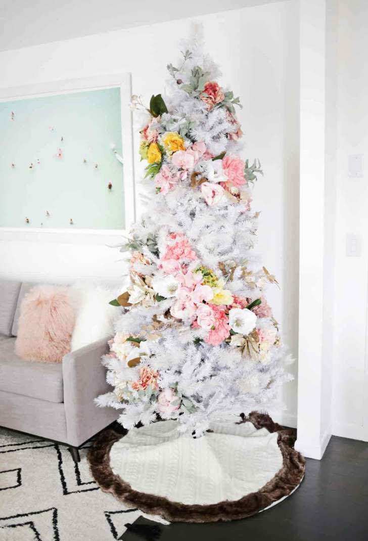 white feminine faux flower Christmas tree with colorful blooms