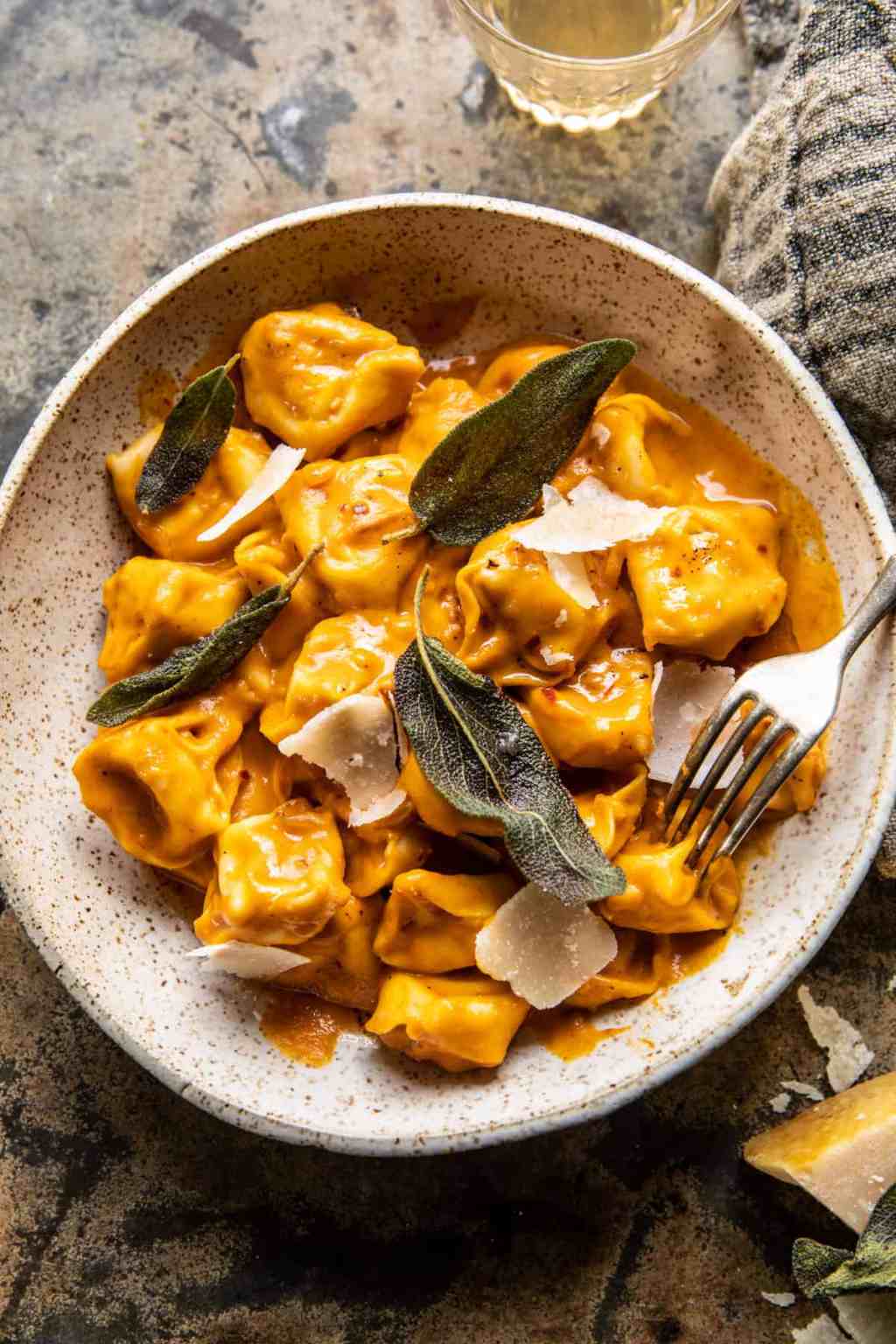 creamy pumpkin tortellini with parmesan and sage garnish easy fall dinner ideas and recipes