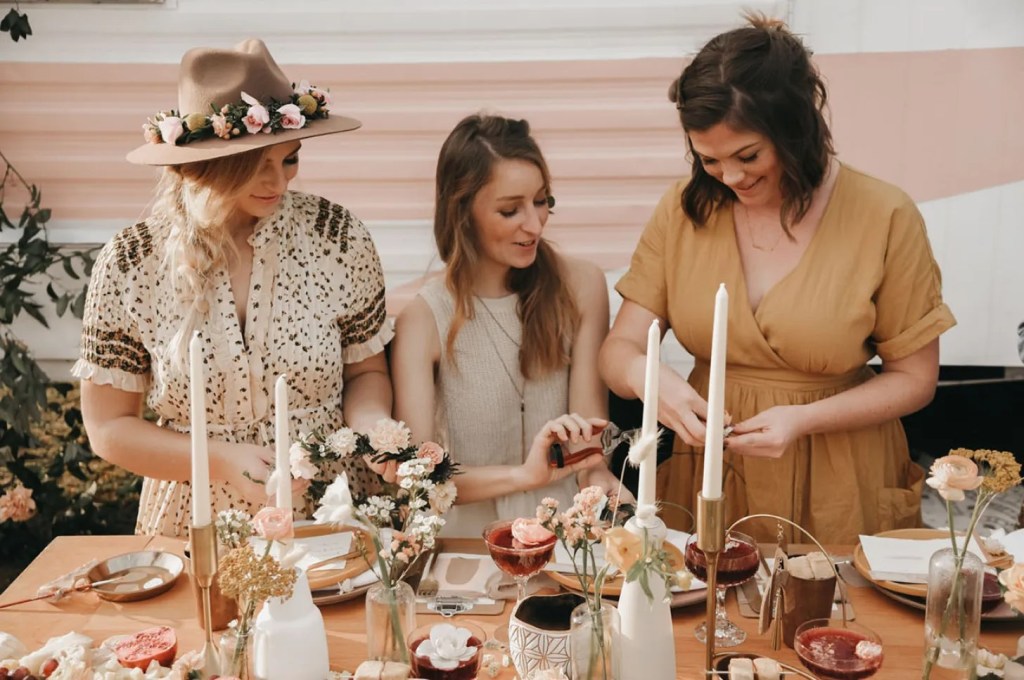 bridal party participating in a flower making class bachelorette party idea