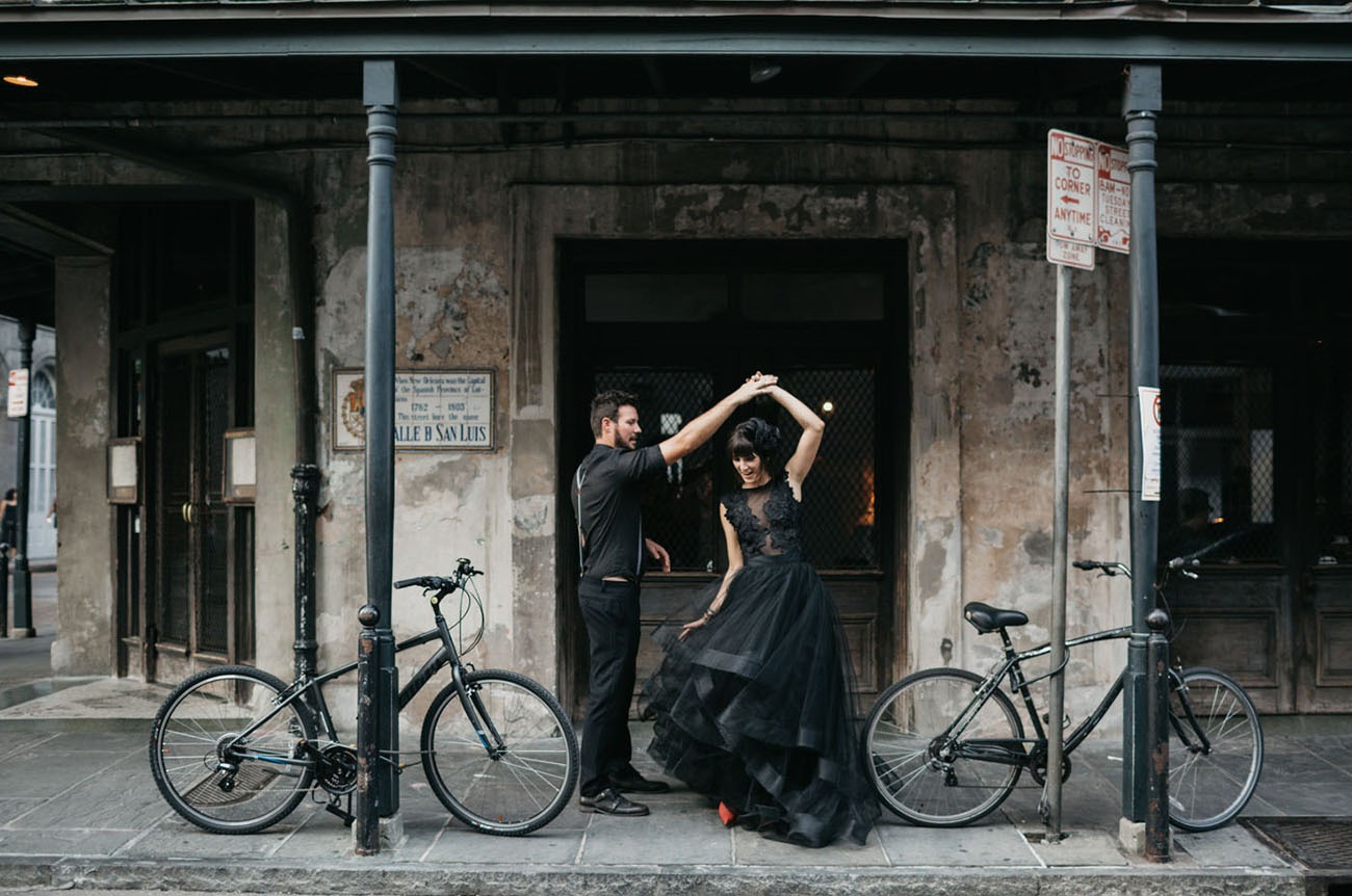 New Orleans Louisiana couple dancing on the sidewalk in an epic honeymoon destination in the US