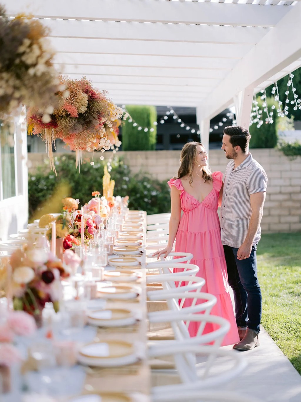 bride and groom attending their joint bachelor and bachelorette party with an al fresco dining setup