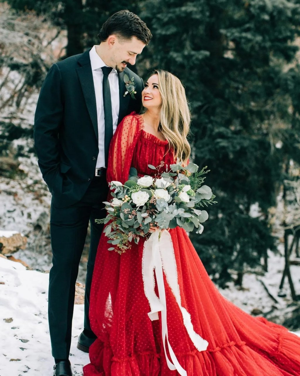 woman wearing a non white bridal gown Christmas wedding ideas on a budget