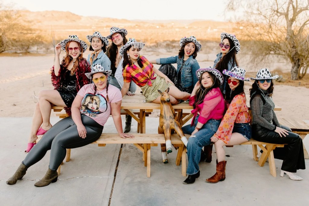Palm Springs bachelorette party ideas theme with all the bridesmaids wearing cowgirl hats