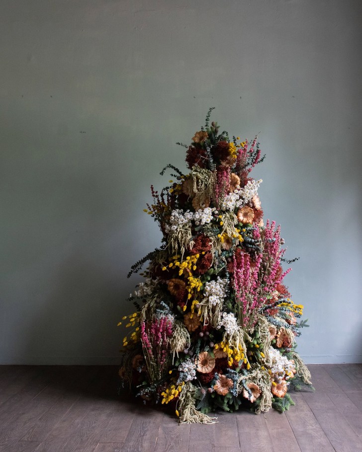 unique lush flower Christmas tree covered in colorful blooms