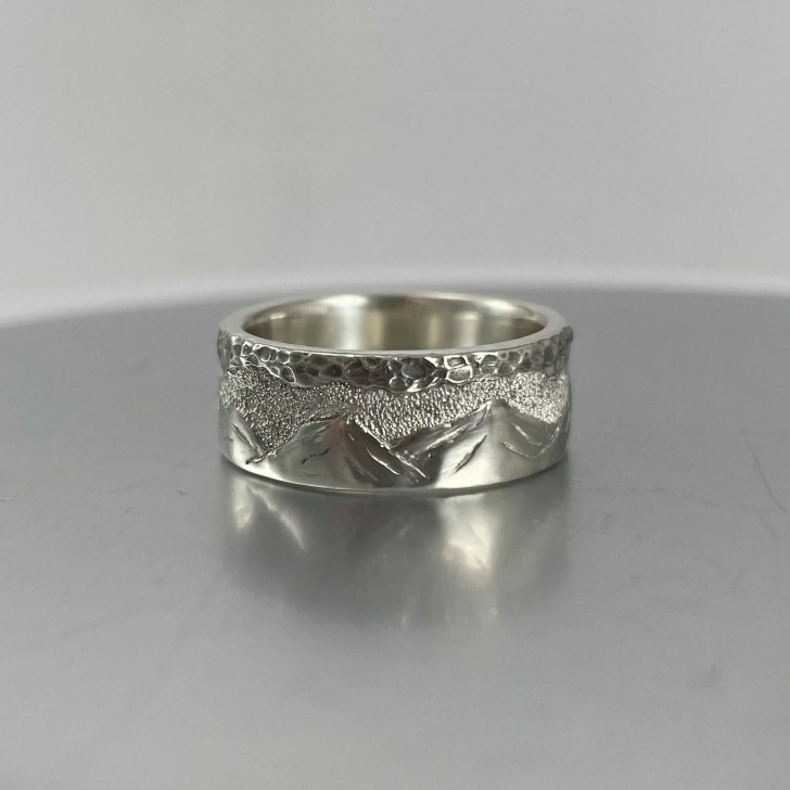unique mens white gold wedding band with volcanoes engraved on it