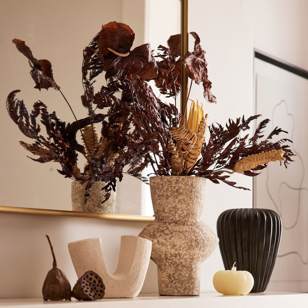 night harvest dried flower bouquet sitting in a spotted ceramic vase from West Elm