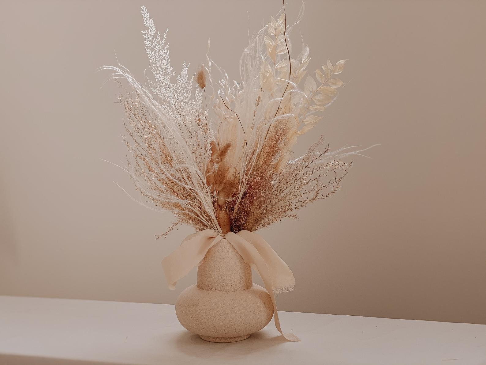 feathery blush neutral arrangement in a vase