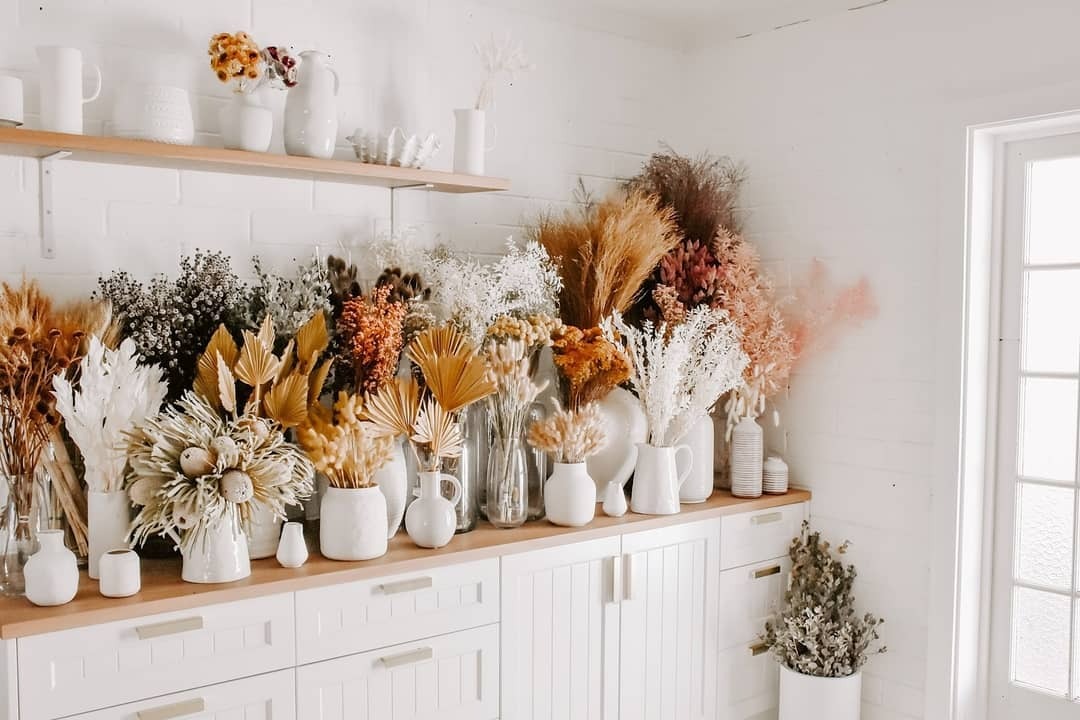 selection of dried flowers and dried flower bouquets placed in a collection on a shelf